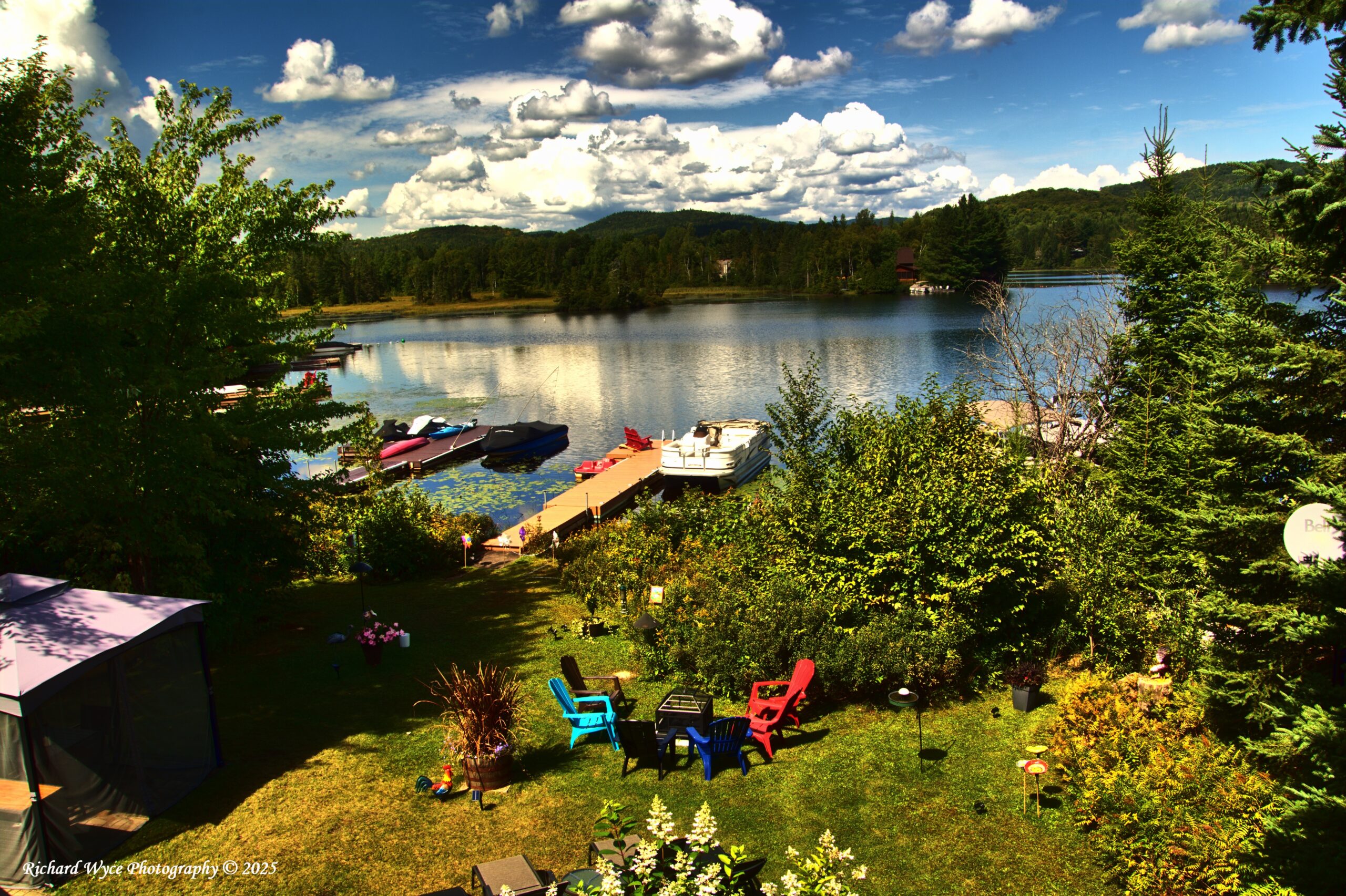 White clouds with the sun starting to set at Lac Cardin QC